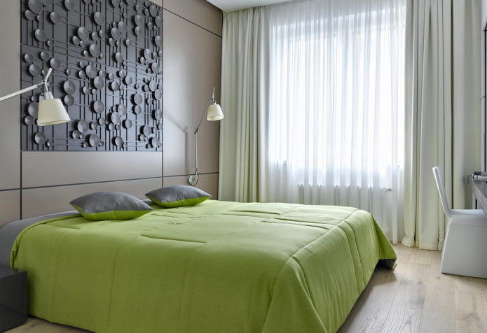 lit avec couvre-lit vert dans la chambre